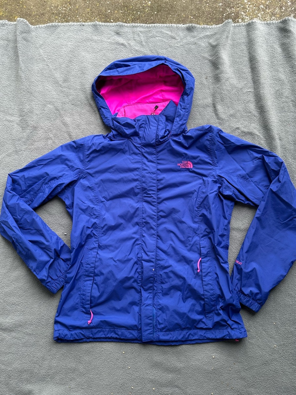 The North Face Woman’s Royal Blue Hooded Raincoat with Pink Lining